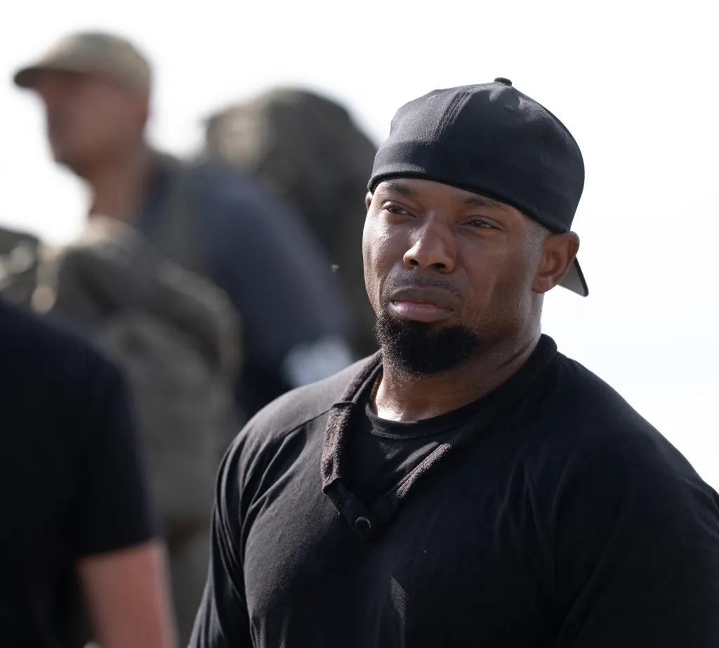 DS agent Jovon Quarles wearing a black cap and shirt.