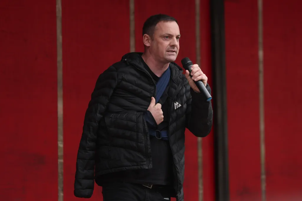 Dublin city councillor Gavin Pepper speaks into a microphone at a rally in O'Connell Street, Dublin.