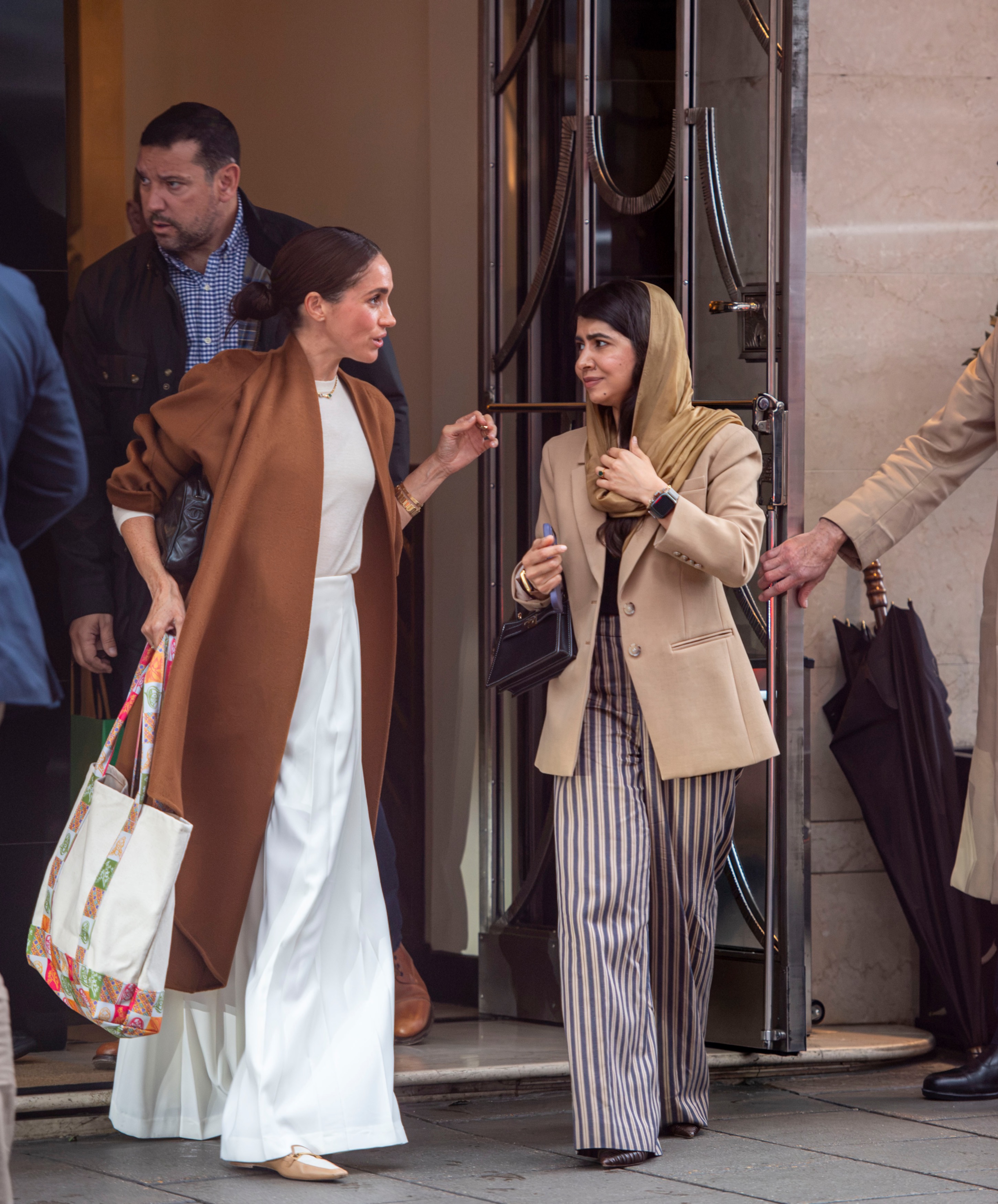 Meghan Markle and Malala Yousafzai leaving Claridge's hotel in London.