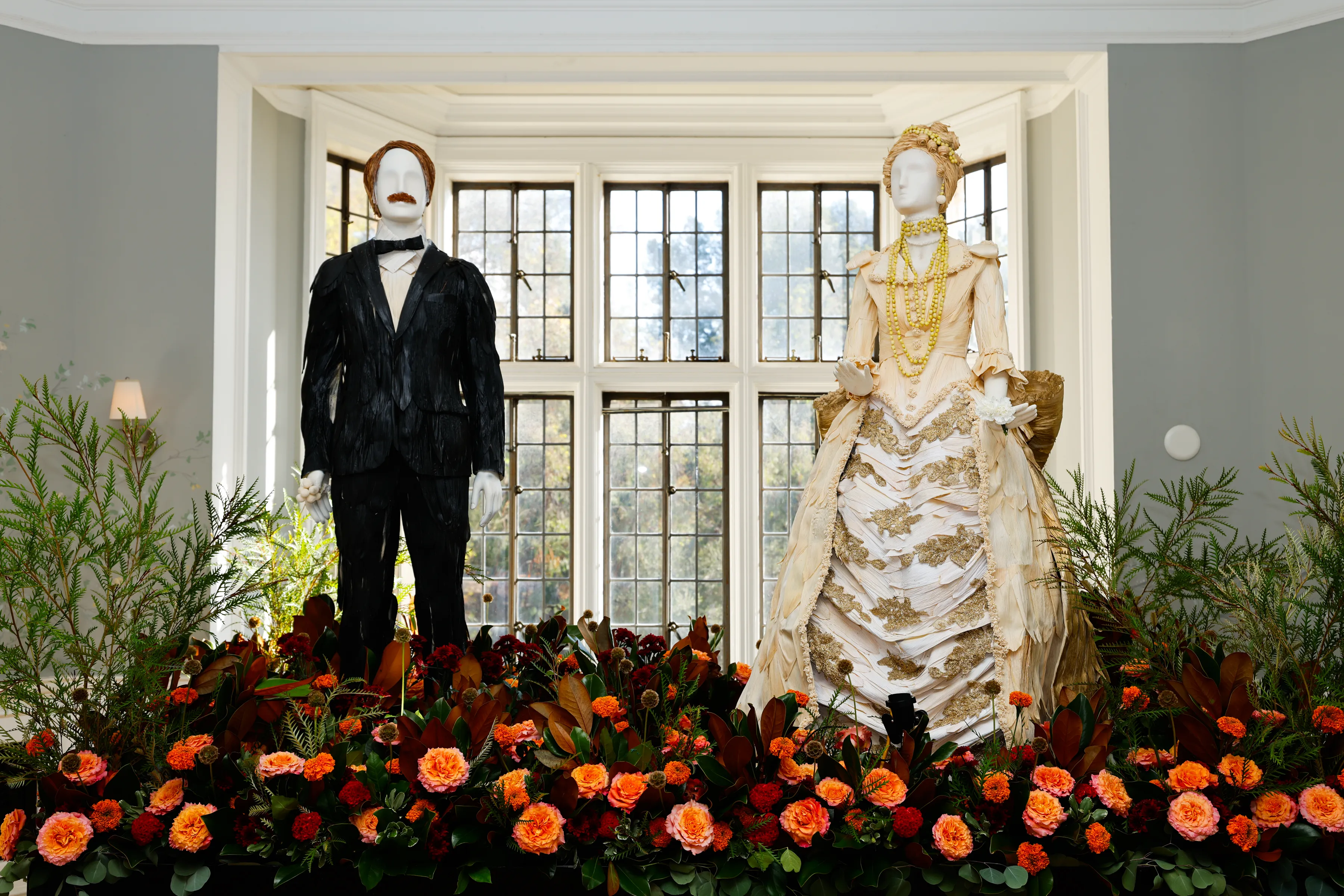 The Duke of Buckingham and Gladys Russel flower sculptures stand at “The Gilded Age’s,” “Fleurs de Villes,” at the Greystone Mansion & Gardens.
