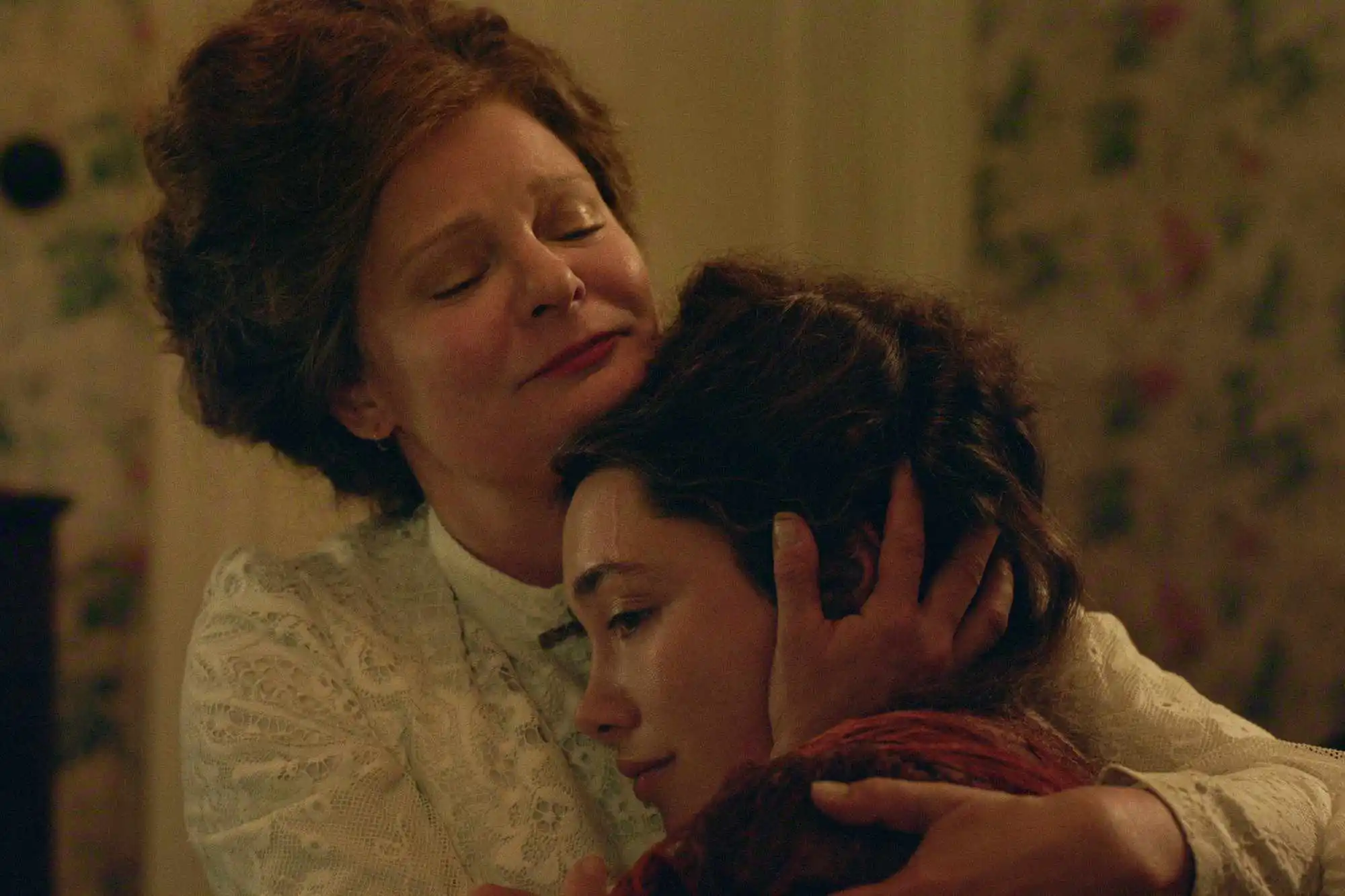 Martha Plimpton hugging someone in a scene from East of Eden.