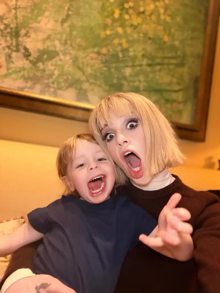 Kelly Osbourne and her son Sidney making funny faces.