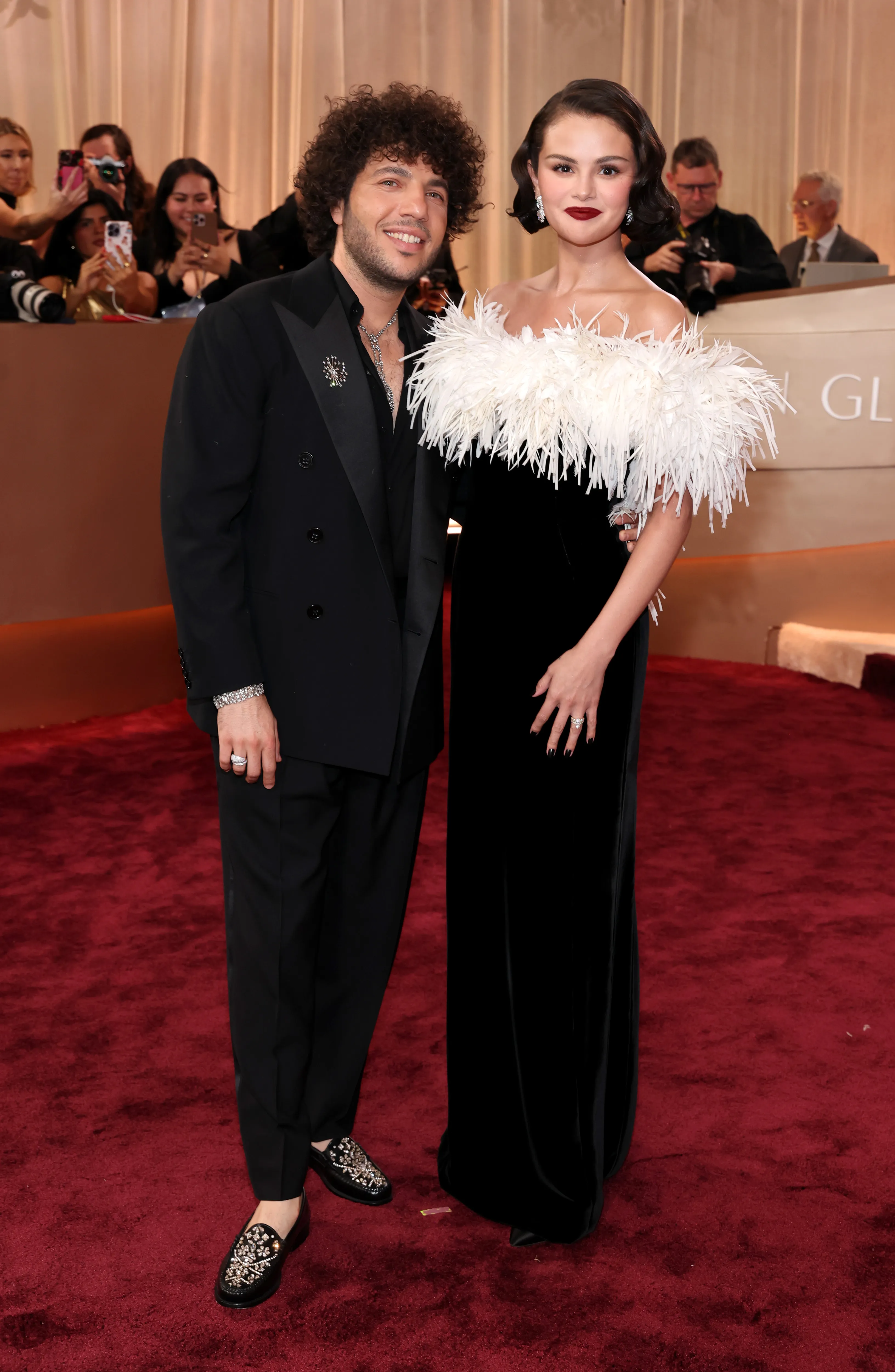 Benny Blanco and Selena Gomez pose together on the red carpet at the Golden Globe Awards.
