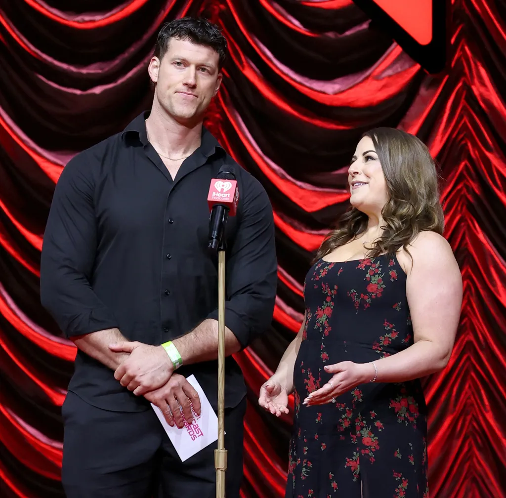Clayton Echard and Stephani Young speaking onstage at an event.