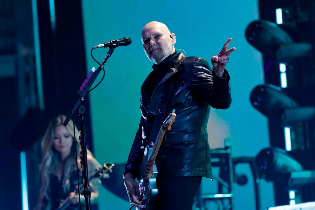 Kiki Wong and Billy Corgan of The Smashing Pumpkins perform onstage.