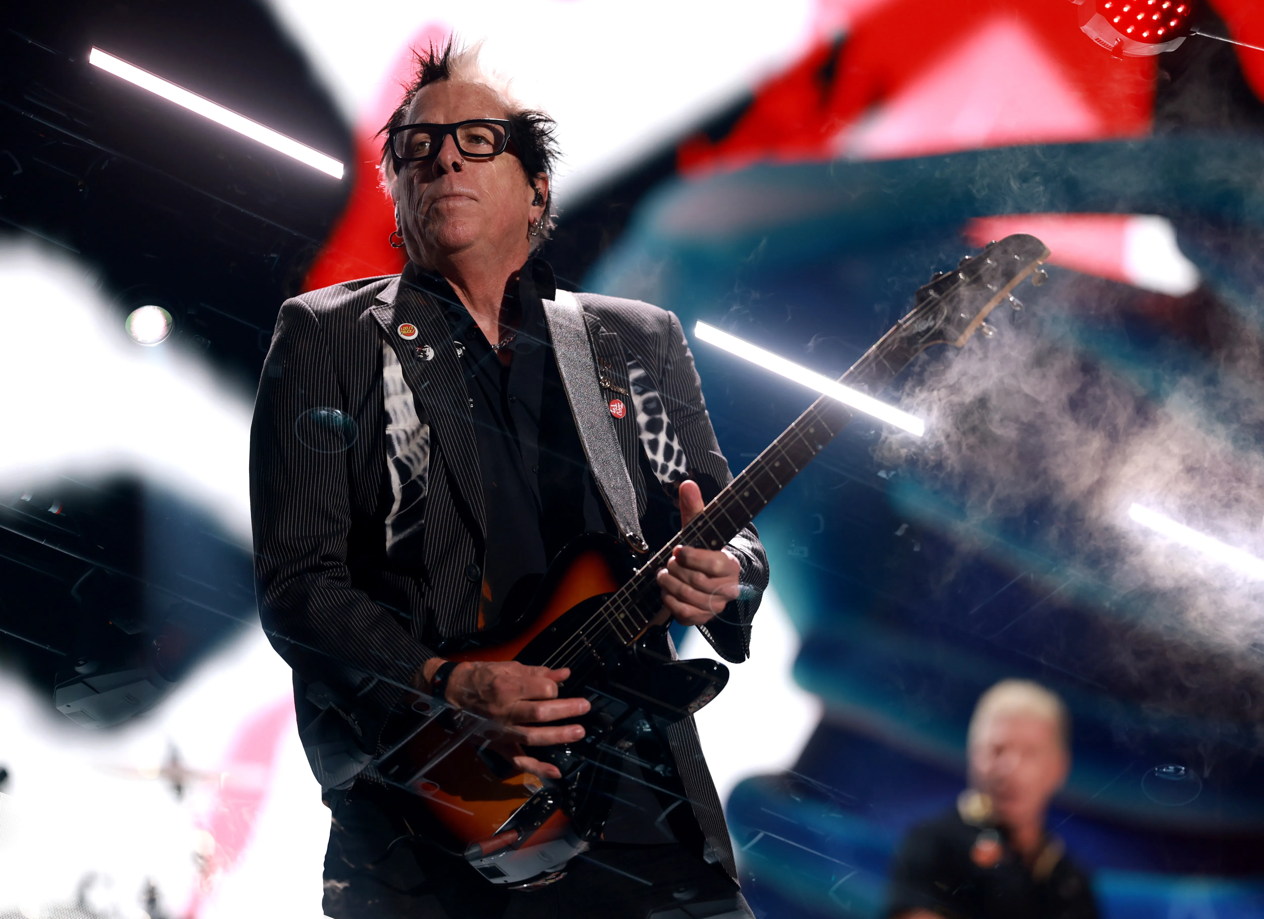 Noodles of The Offspring performs onstage during a concert.