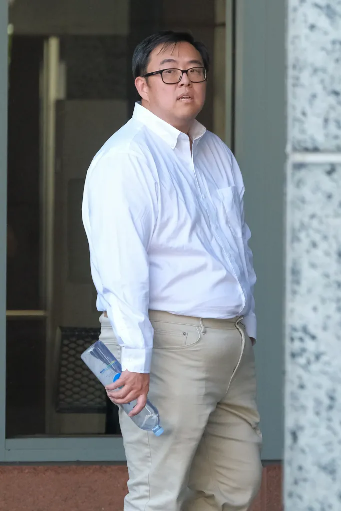 Edric Ding walking outside the federal courthouse in Los Angeles.
