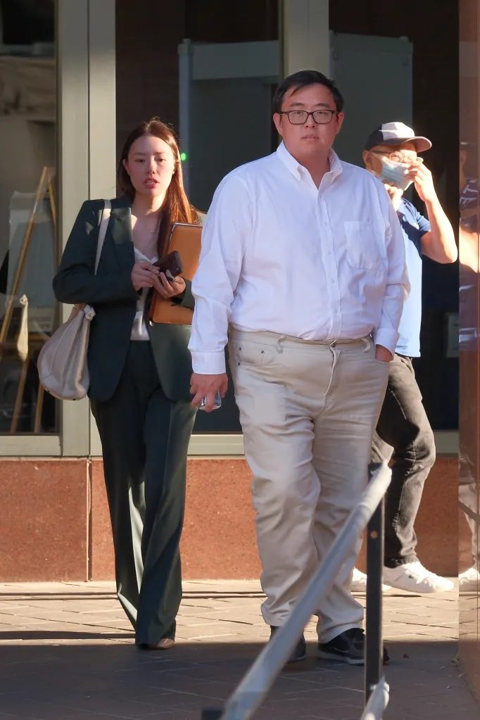 Edric Ding walks outside the federal courthouse after attending his wife's hearing.
