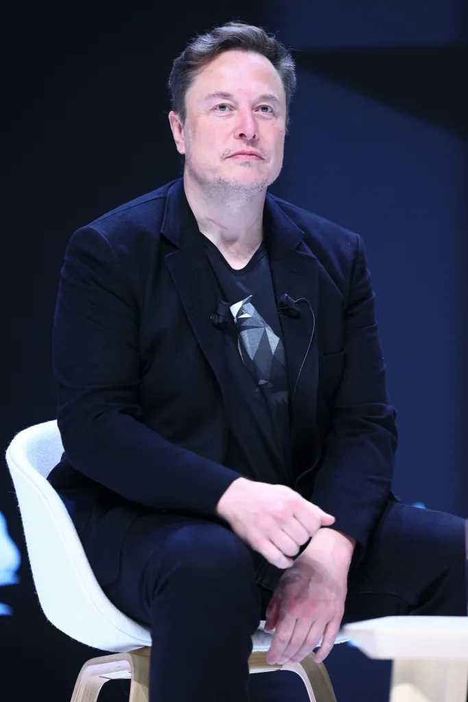 Elon Musk attending a panel session.