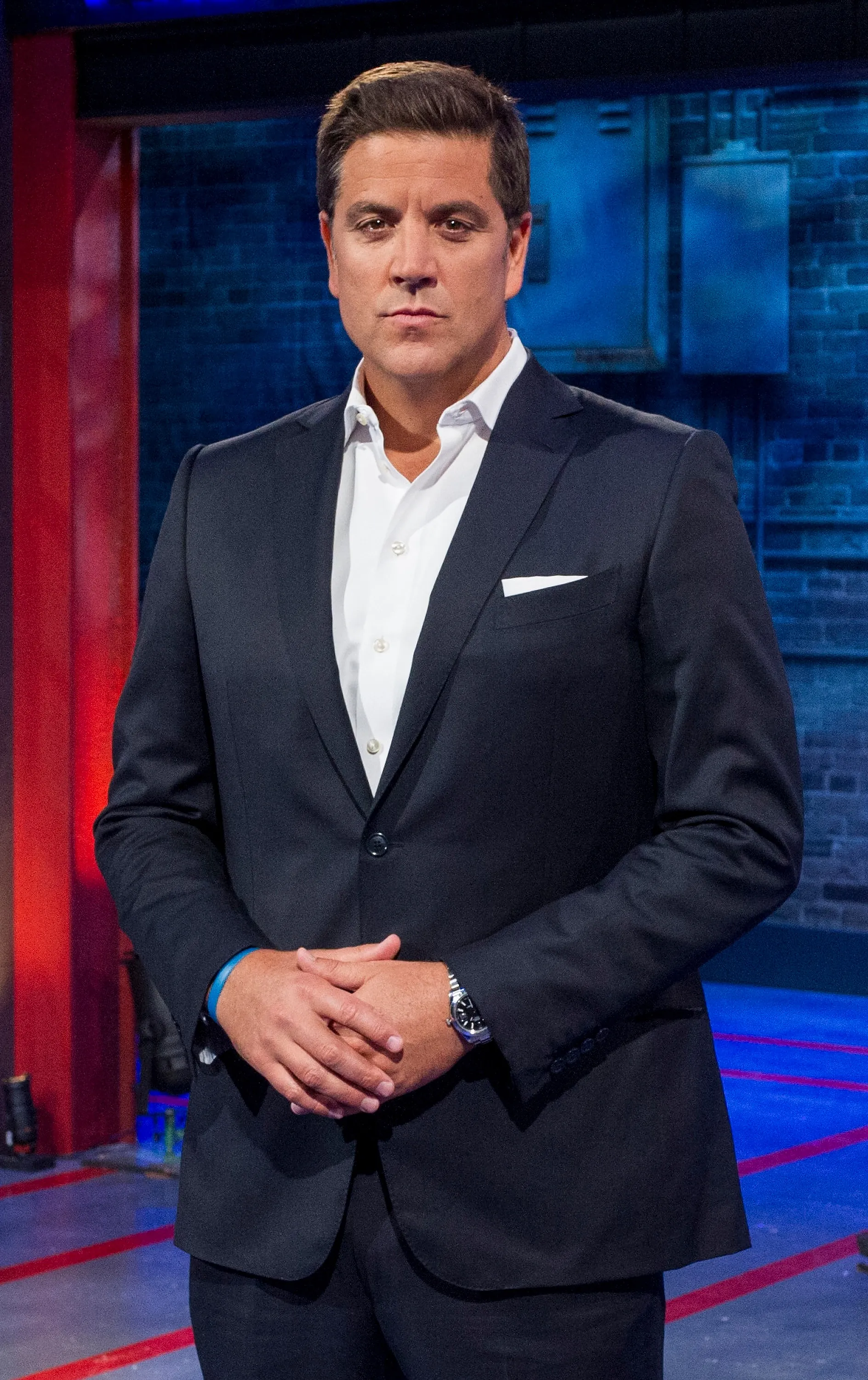 Emmy Award-winning television journalist Josh Elliott in a suit.