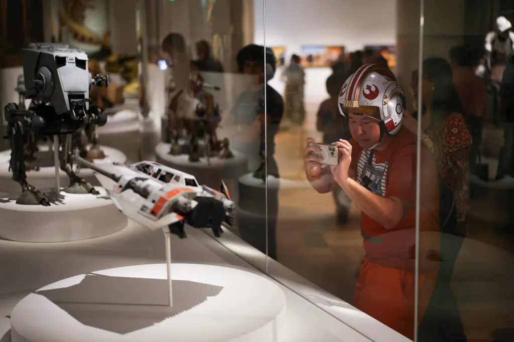 Eric Cheung wears a Star Wars X-Wing Pilot hat at the Lucas Museum of Narrative Art during its opening to the public in Los Angeles.