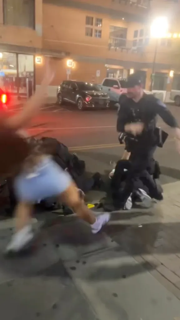 Arizona State University student Eryn Kelise Bonner being shoved to ground and pummeled by police officers.