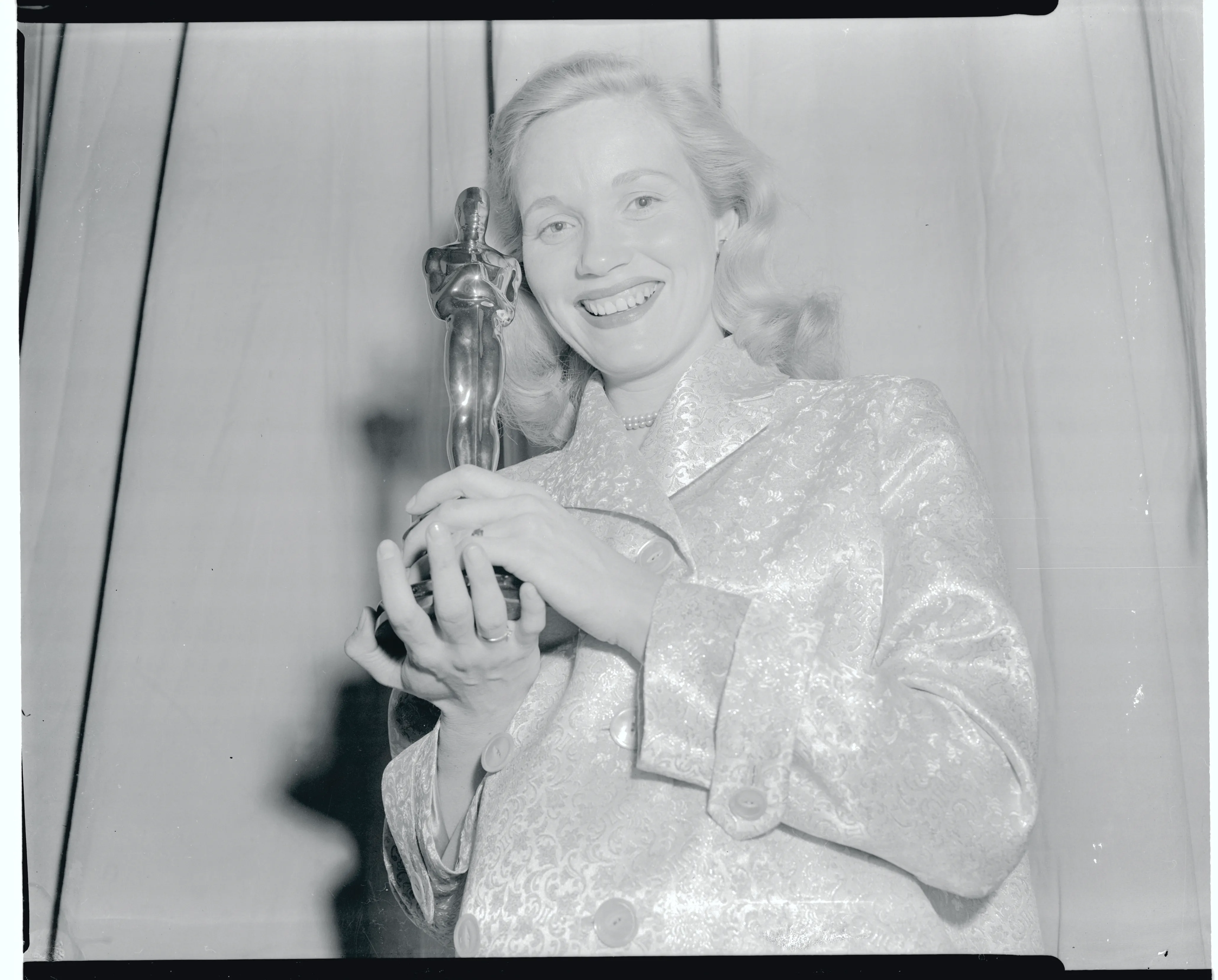 Eva Marie Saint holding her Oscar.