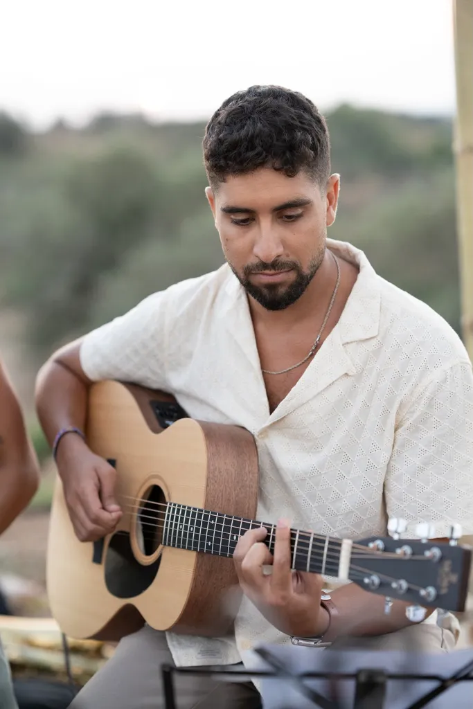 Evyatar David plays the guitar.