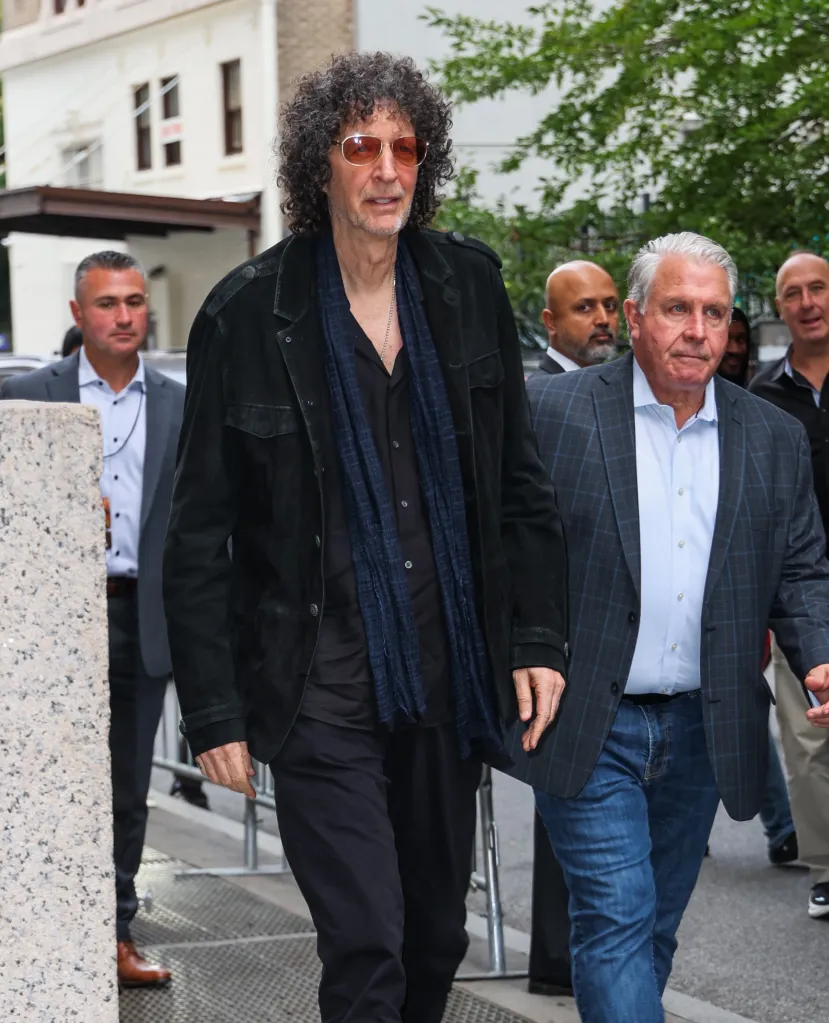 Howard Stern walking outside with security in Brooklyn, New York.