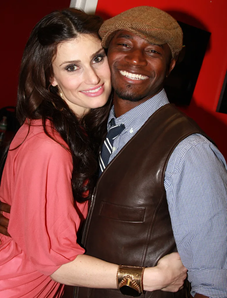 Singer and actress Idina Menzel poses with her husband, actor Taye Diggs.