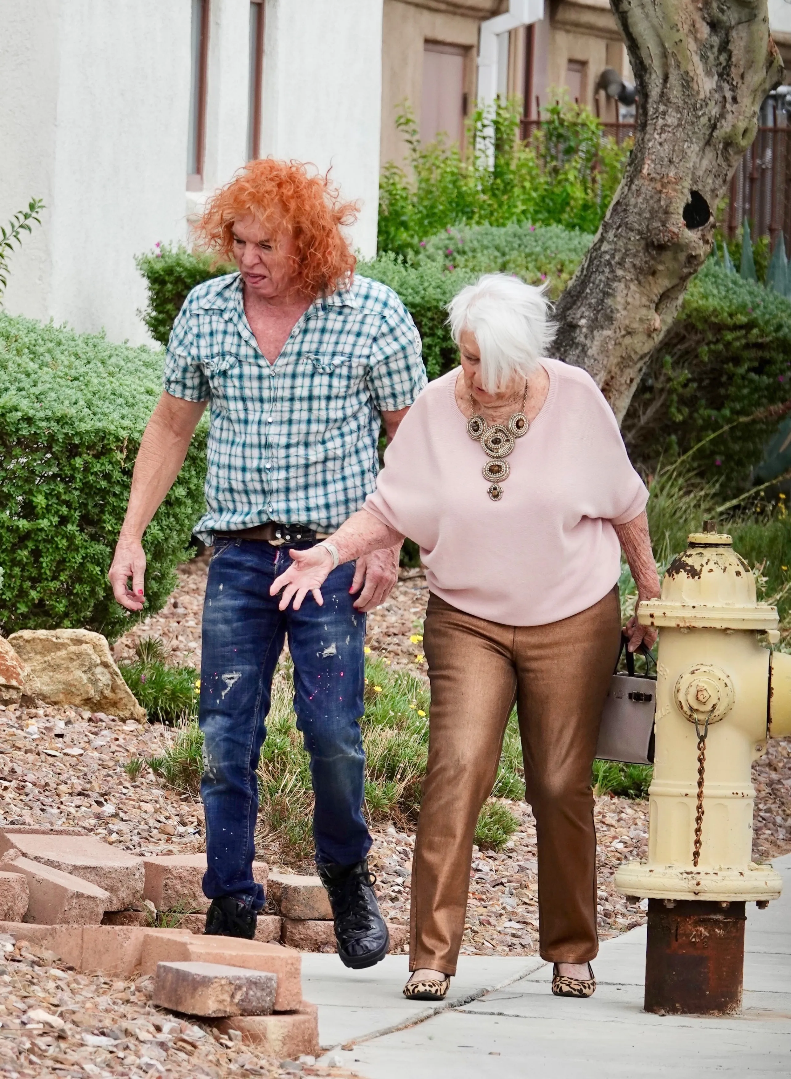 Scott Thompson, known as Carrot Top, and his mother, Dona Wood, walking together in Las Vegas.