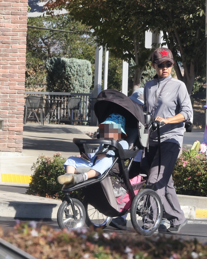 Candice Jang walks with her child in Oakland, California.