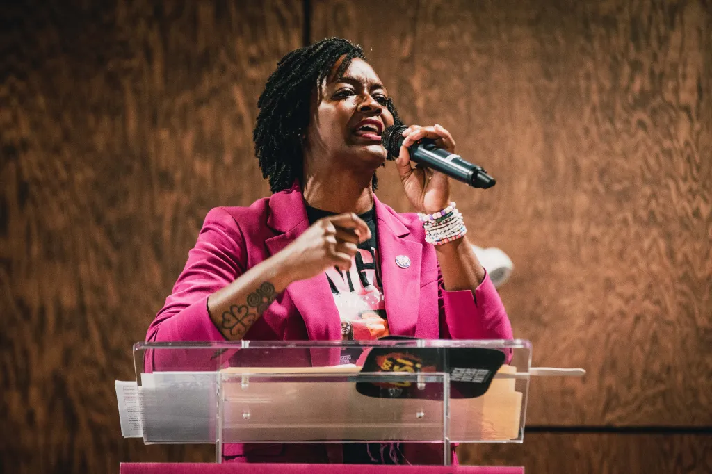 Florida State Rep. Angie Nixon speaks into a microphone at a campaign rally in Tampa, Fla.