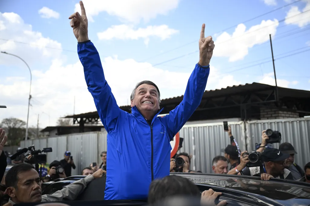 Former Brazilian President Jair Bolsonaro greets supporters during Capital Moto Week in Brasilia.