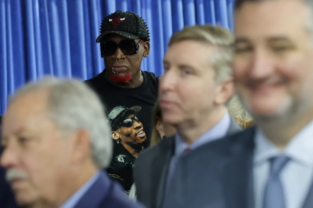 Former NBA player Dennis Rodman stands in a crowd during a visit by U.S. President Donald Trump to Peterbilt Motors in Denton, Texas.