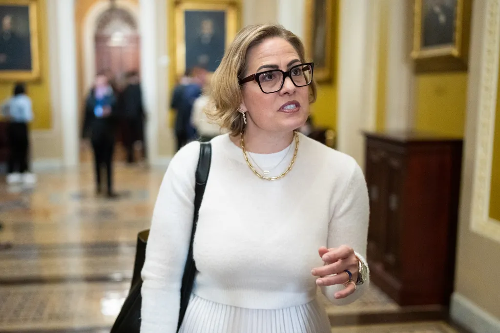 Former Sen. Kyrsten Sinema, I-Ariz., speaks to reporters in the Ohio Clock Corridor in the U.S. Capitol.