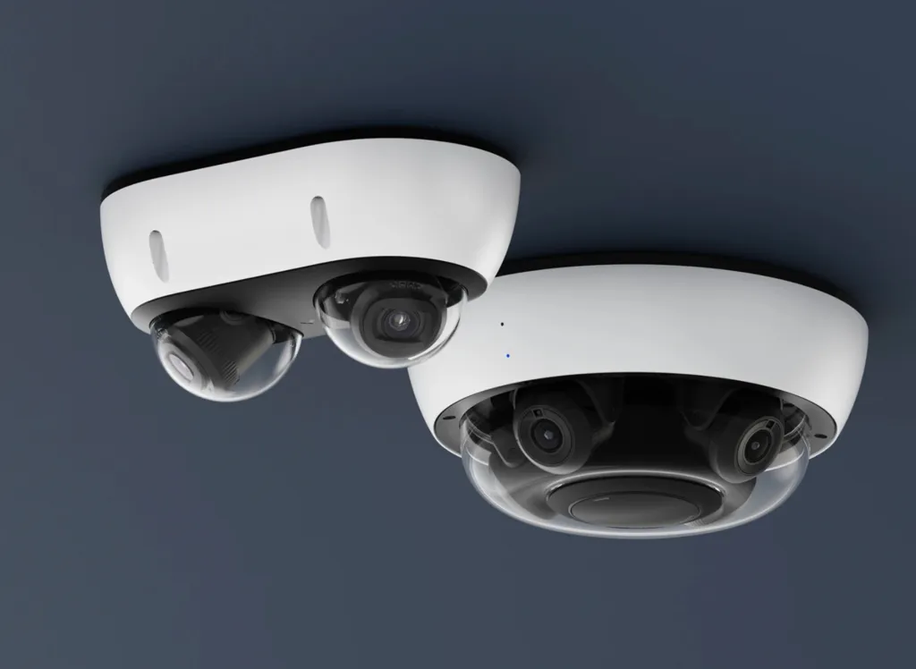 Two multisensor security cameras mounted on a ceiling.