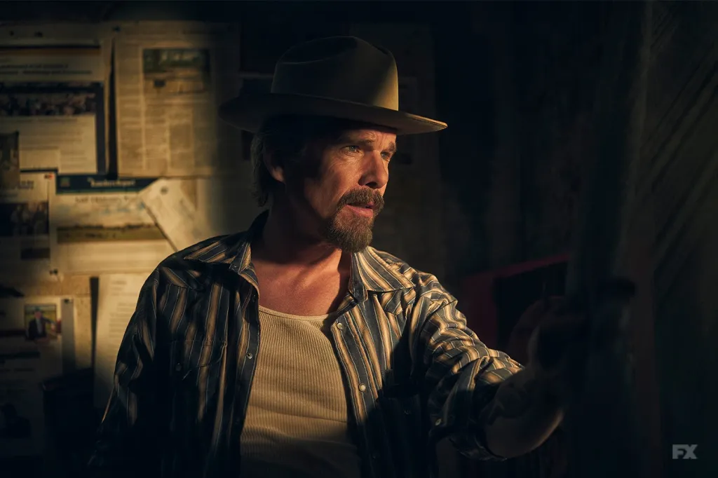 Ethan Hawke as Lee Raybon in The Lowdown, wearing a cowboy hat and striped shirt.
