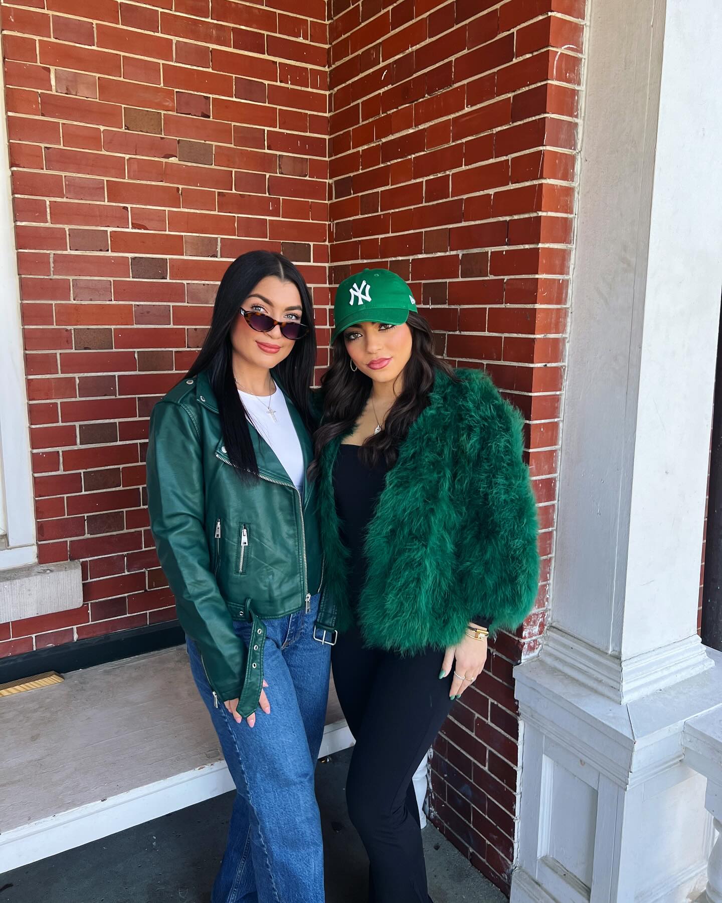 Gabriella and Milania Giudice posing together, both wearing green jackets.