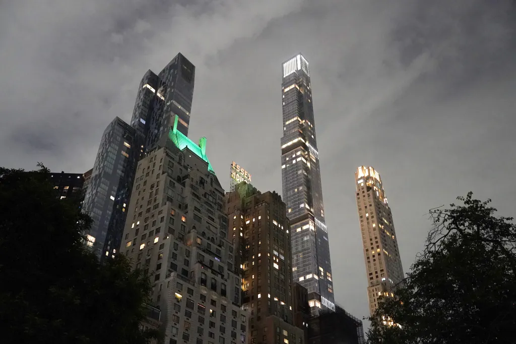 Luxury buildings in Billionaire's Row at night in New York, NY.