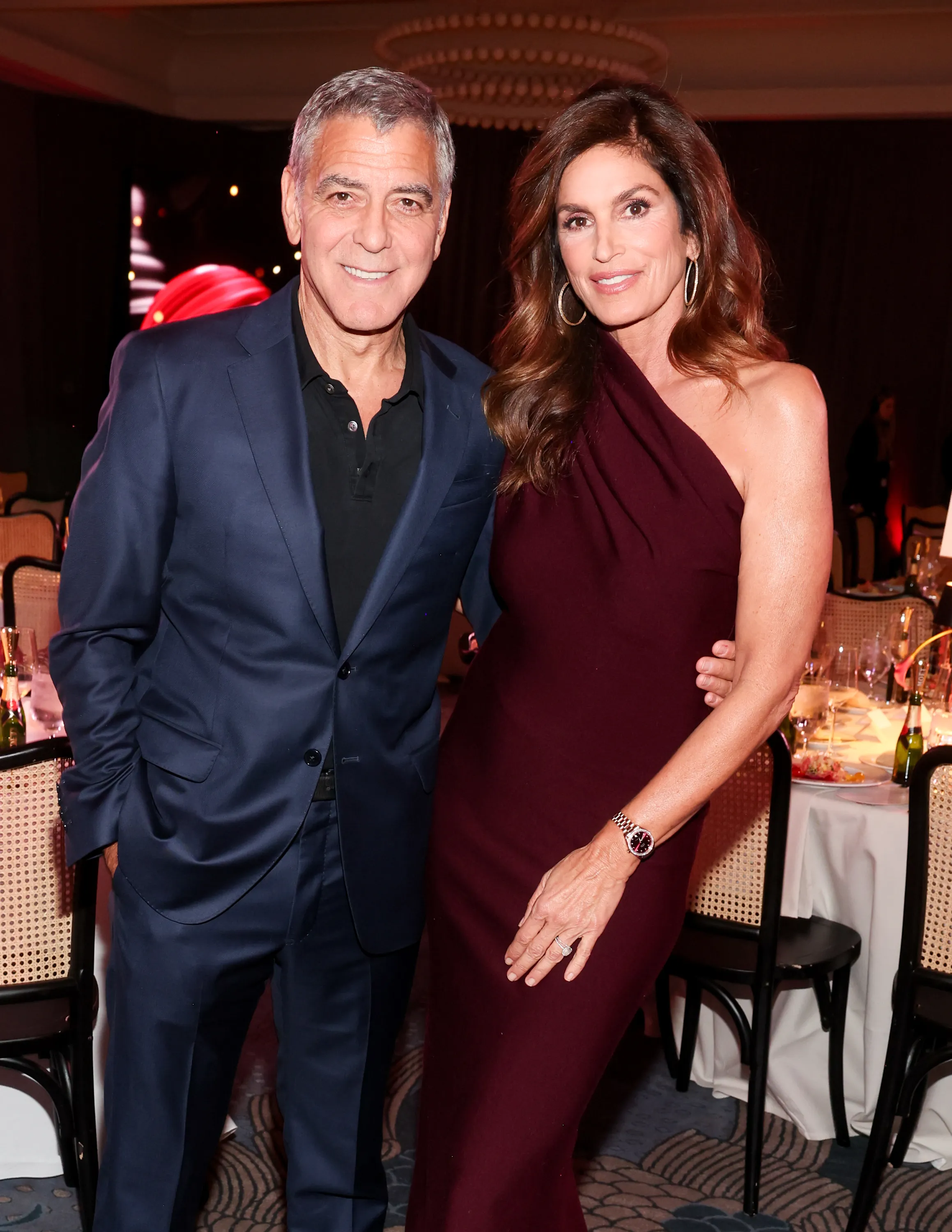 George Clooney and Cindy Crawford pose together at the WWD Style Awards.