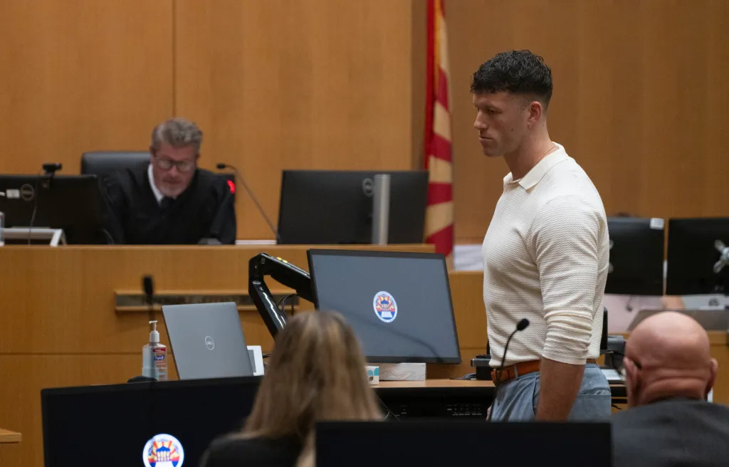 Clayton Echard in a courtroom during a sentencing hearing.