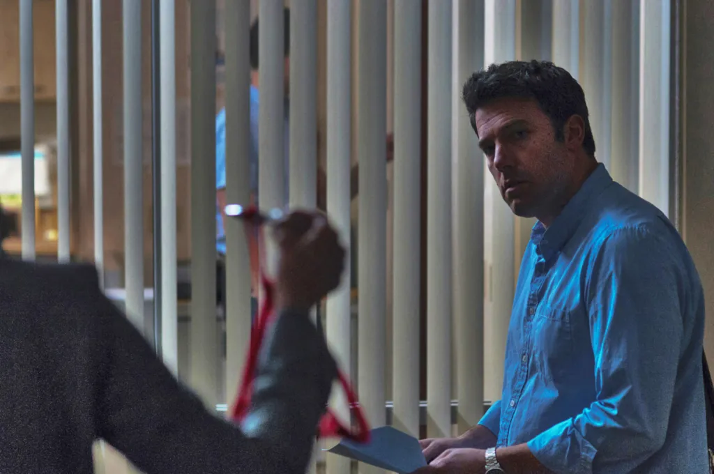 Ben Affleck wearing a blue shirt in Gone Girl.