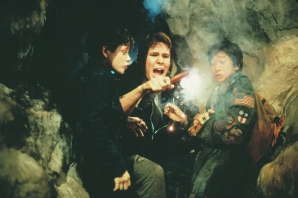 Josh Brolin, Martha Plimpton, and Jonathan Ke Quan in a scene from The Goonies.