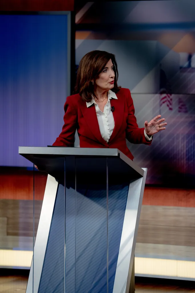 Gov. Kathy Hochul at a podium during a debate.