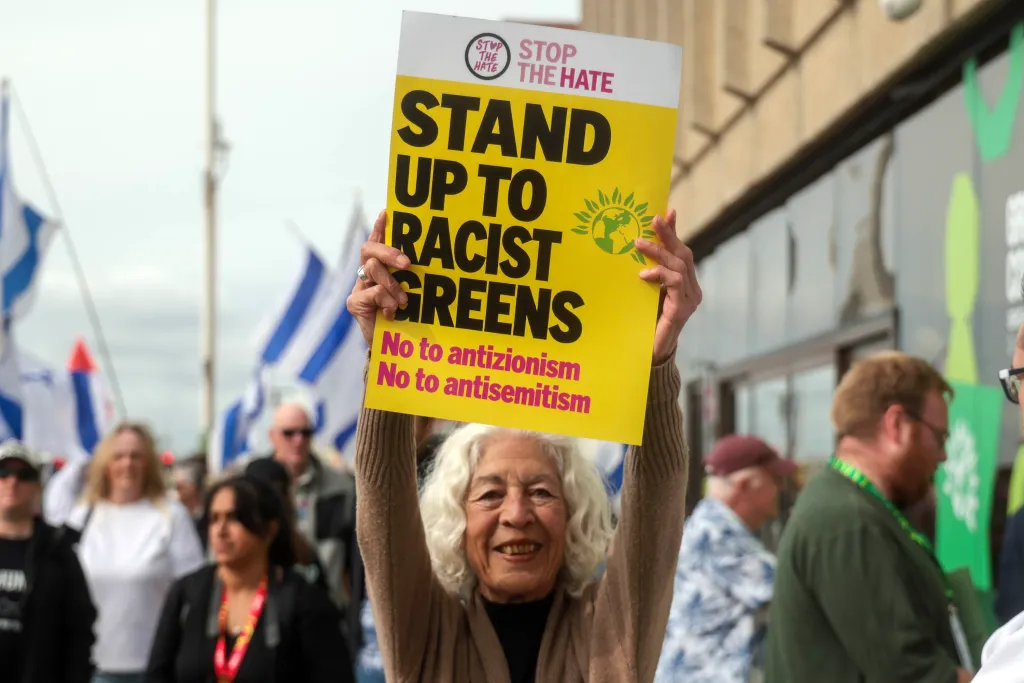 A protester holds a sign that reads 