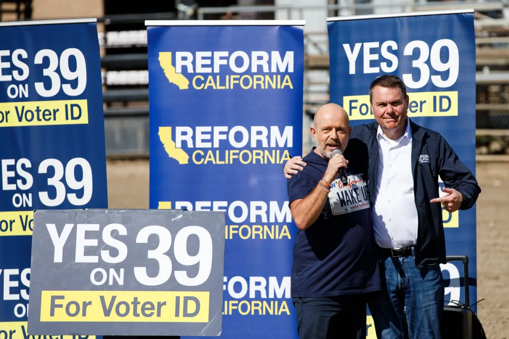 Gubernatorial candidate Steve Hilton and Assemblymember Carl DeMaio embrace at a rally in San Diego, California.