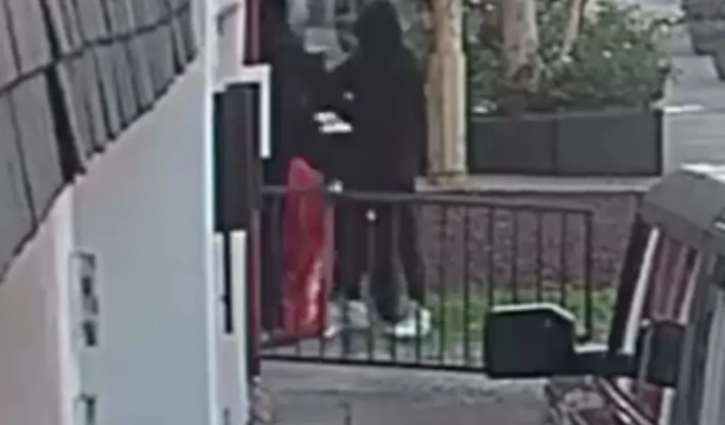 Surveillance footage of a robbery outside a clothing store in West Hollywood.
