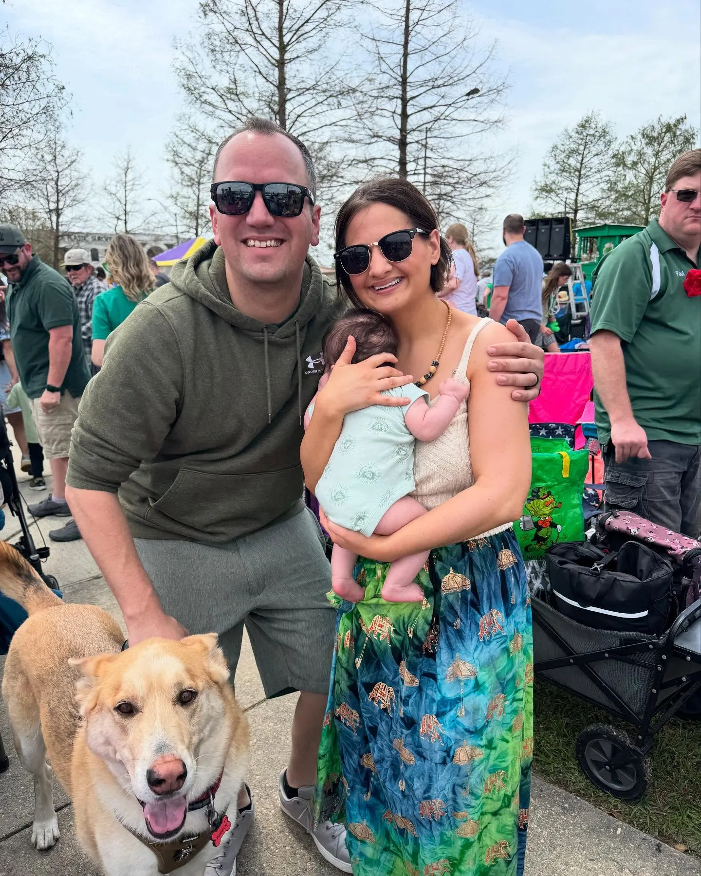 Gypsy Rose Blanchard and Ken Urker posing with their baby and dog outdoors.