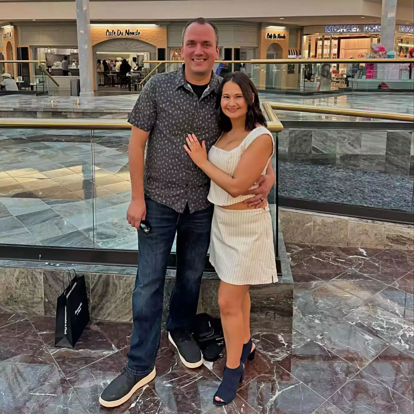 Gypsy Rose Blanchard and Ken Urker posing together in a shopping mall.
