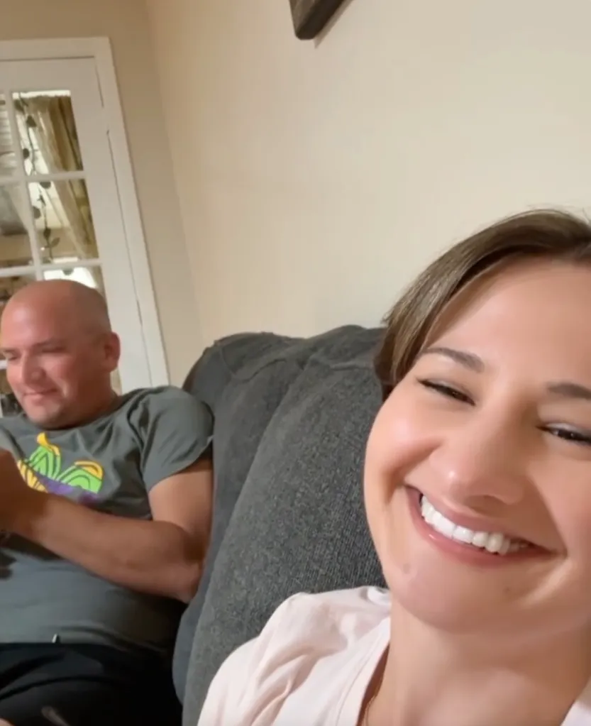 Gypsy Rose Blanchard smiling while sitting on a couch next to Ken Urker.