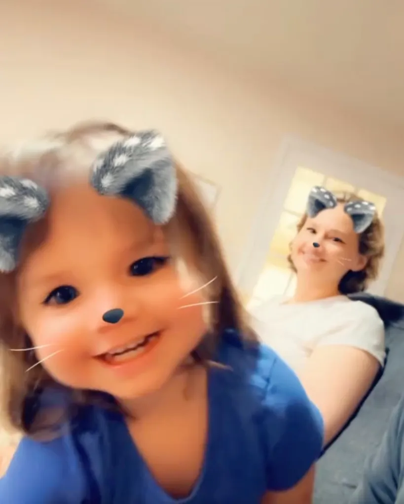 Gypsy Rose Blanchard and a young child wearing cat-filter effects.