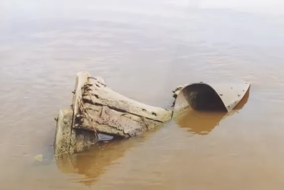 Remnants of the A.H. Pitz shipwreck exposed in shallow water.