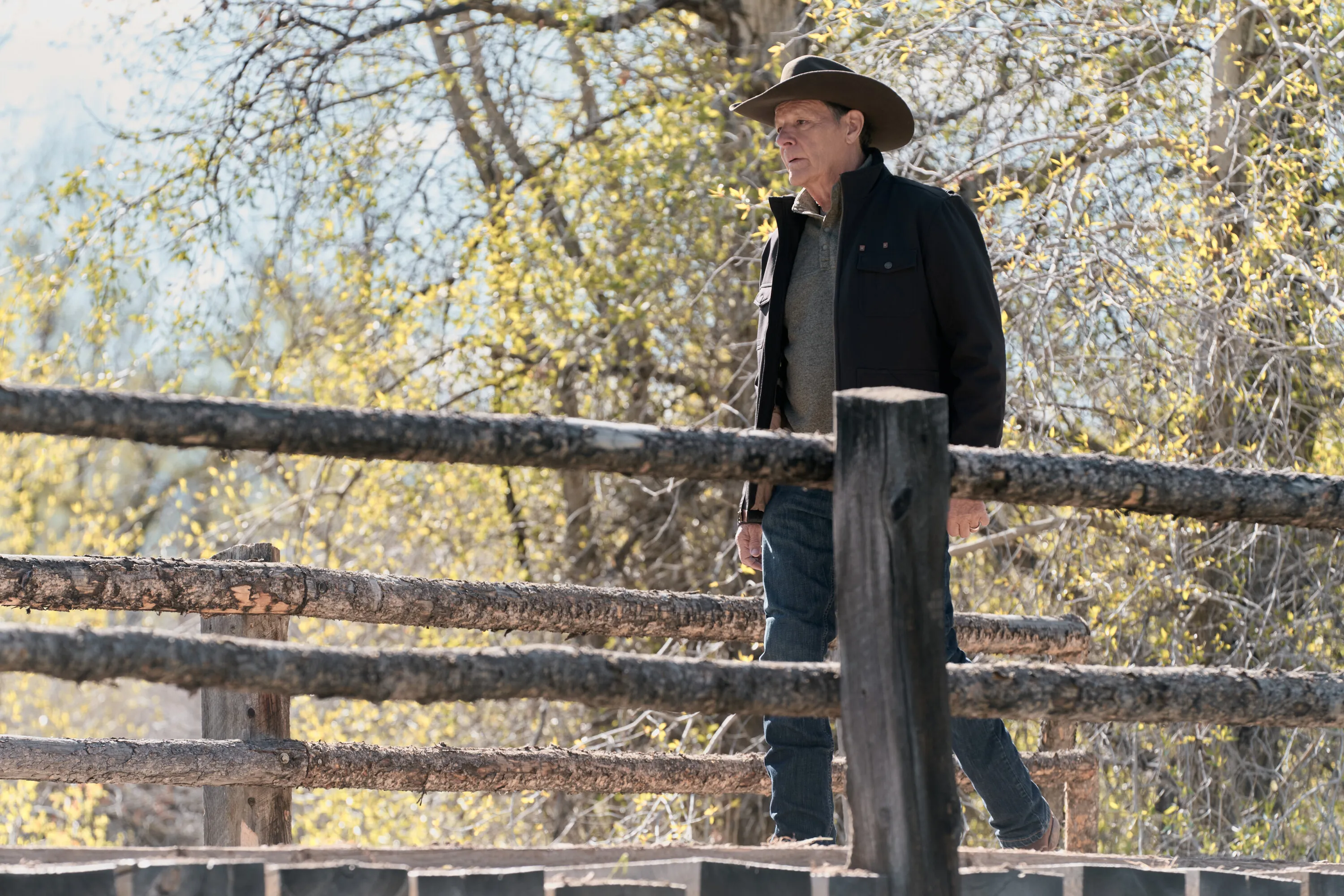 Chris Mulkey as Tom Weaver walking past a rustic wooden fence in the CBS series Marshals.