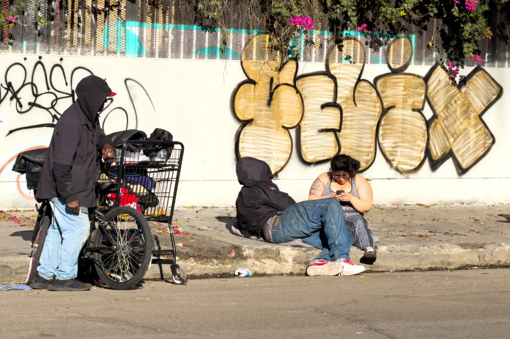 Homeless people gather in the Skid Row area of Los Angeles.