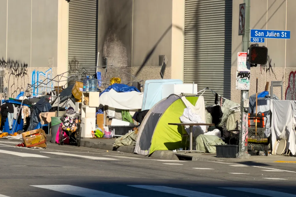Homeless people gather in the Skid Row area of Los Angeles.
