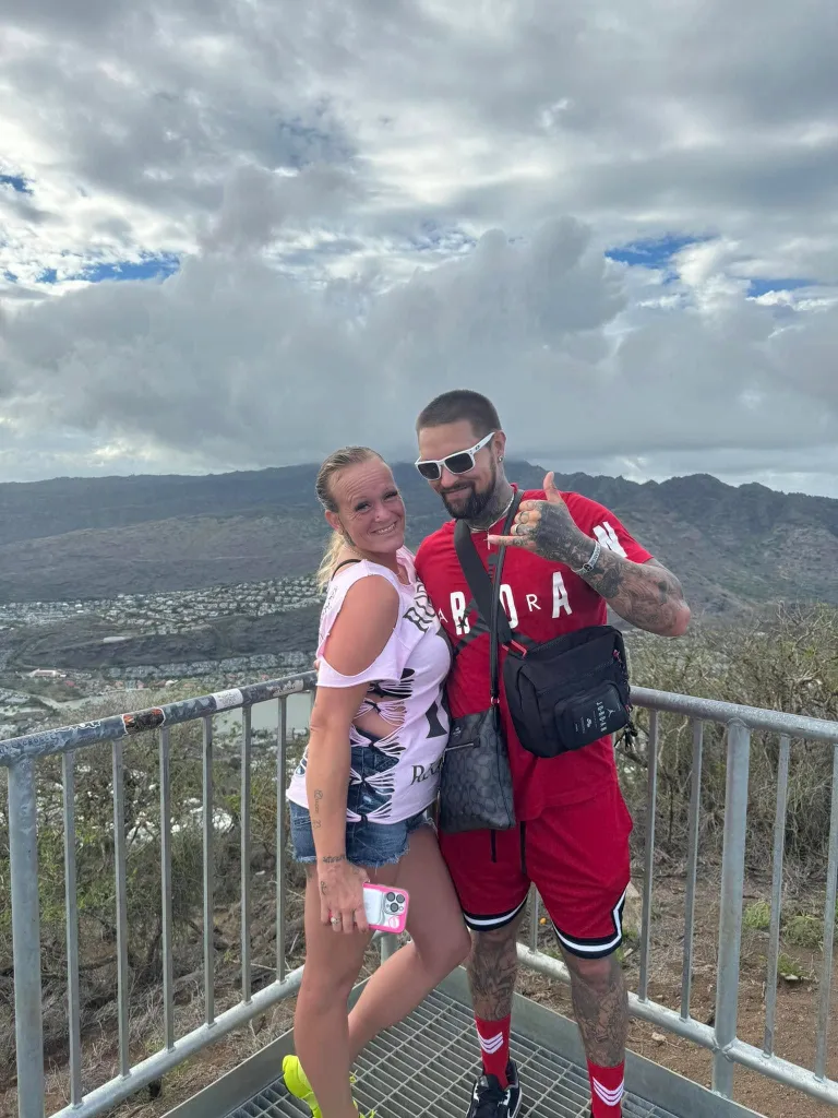 Cody and Honey Phipps standing together on a mountain overlook.