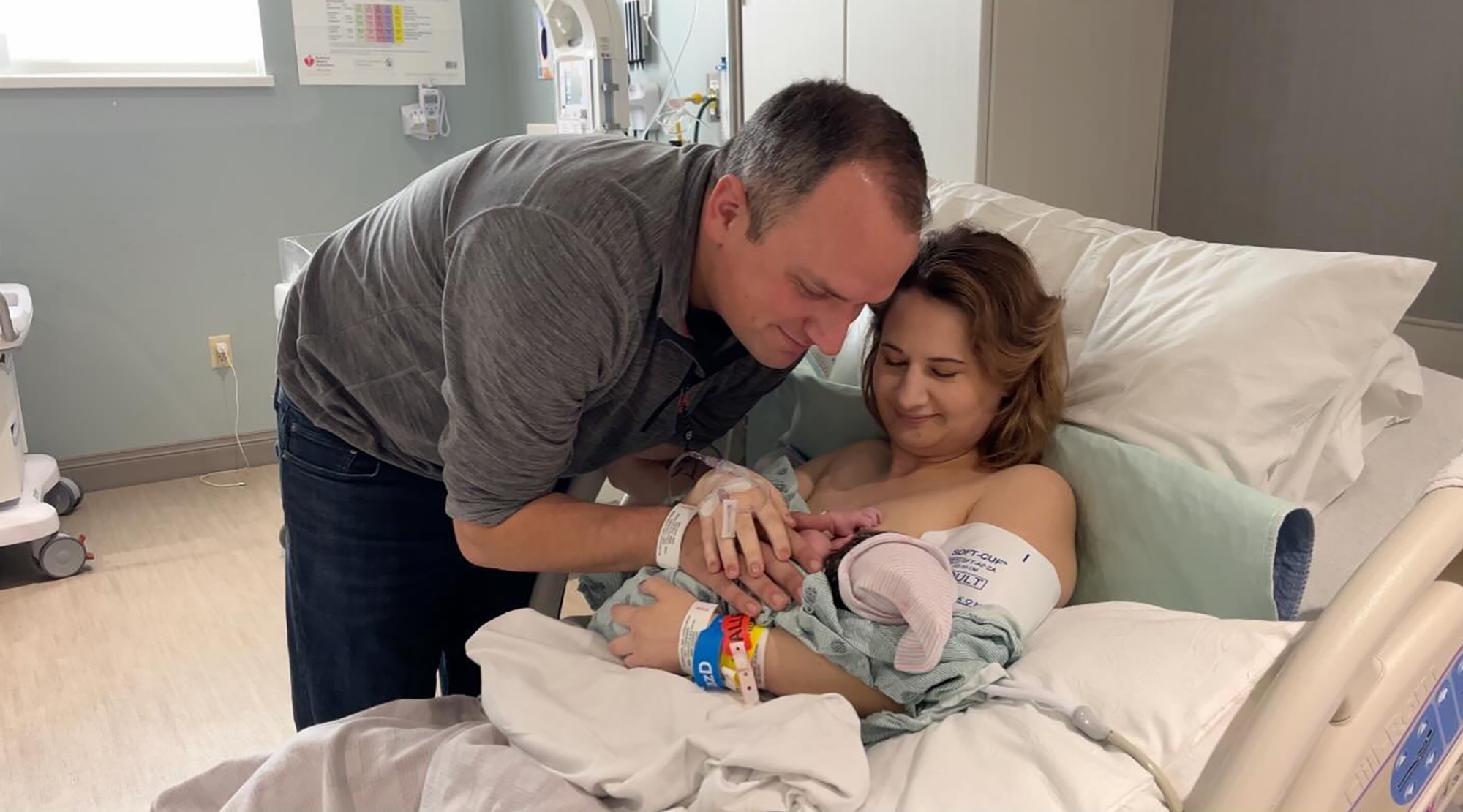 Gypsy Rose Blanchard and Ken Urker in a hospital room with their newborn baby.