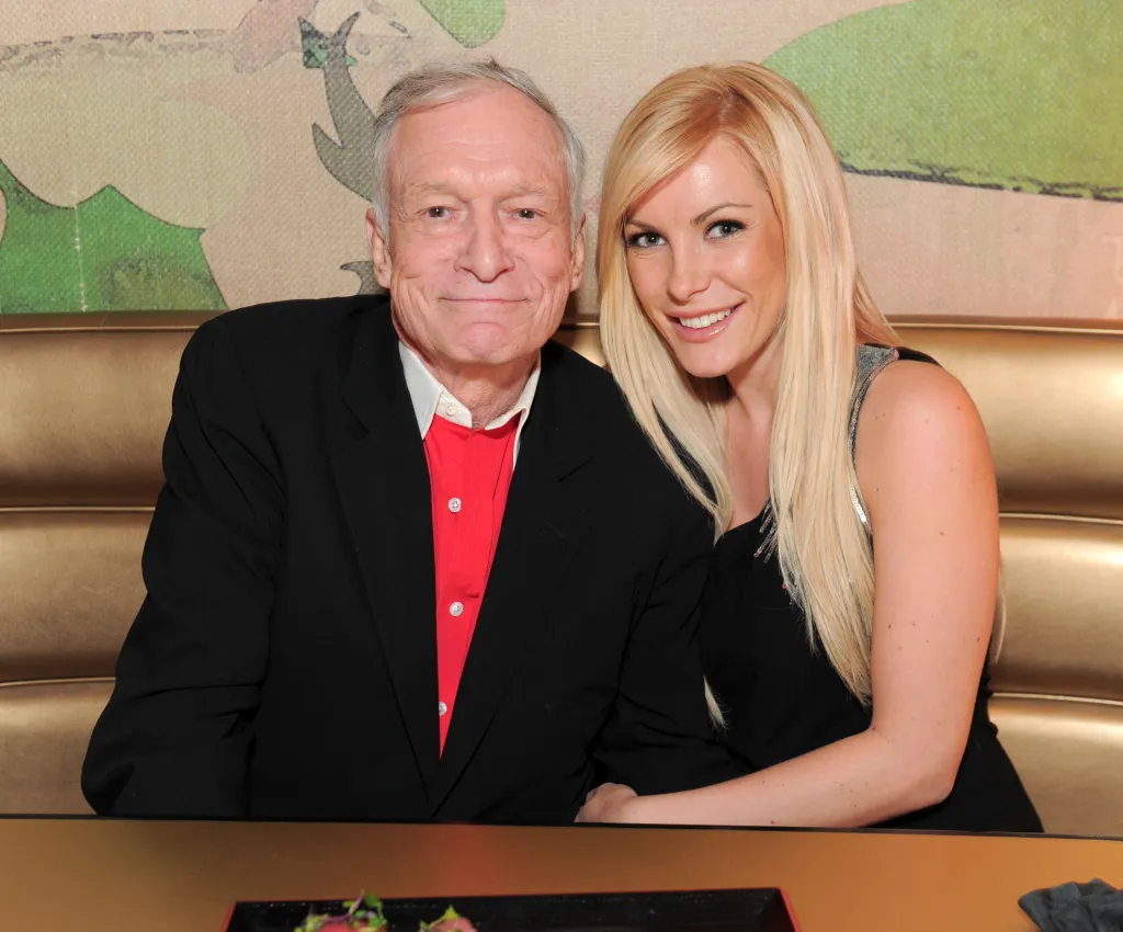 Hugh Hefner and Crystal Harris posing together at a party.