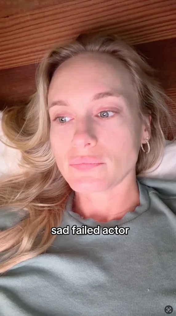 A close-up of a blonde woman lying down, looking somber with the text 